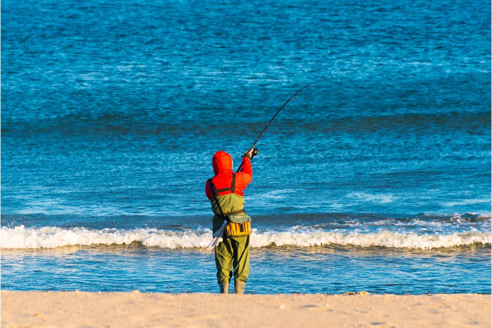 A Fisherman Casts His Line Into the Surf