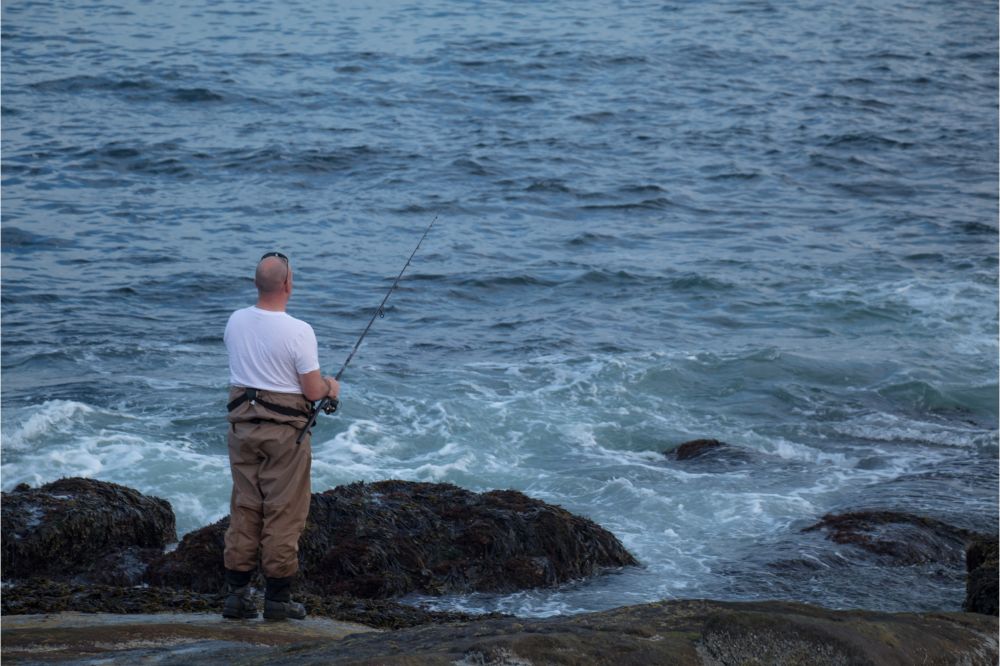 man fishing in a high tide