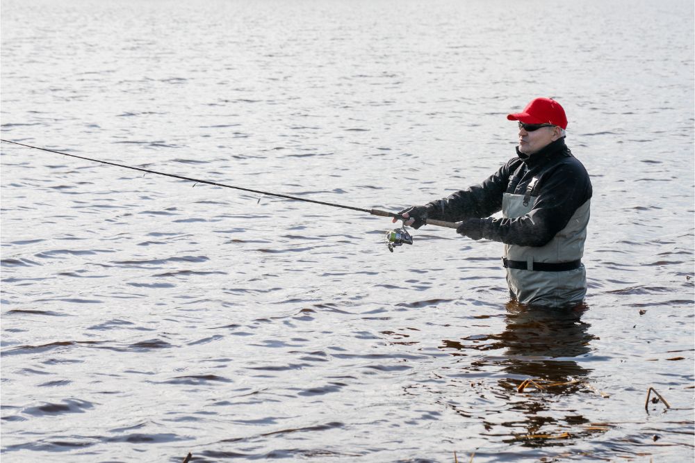 fisherman wearing fishing waders