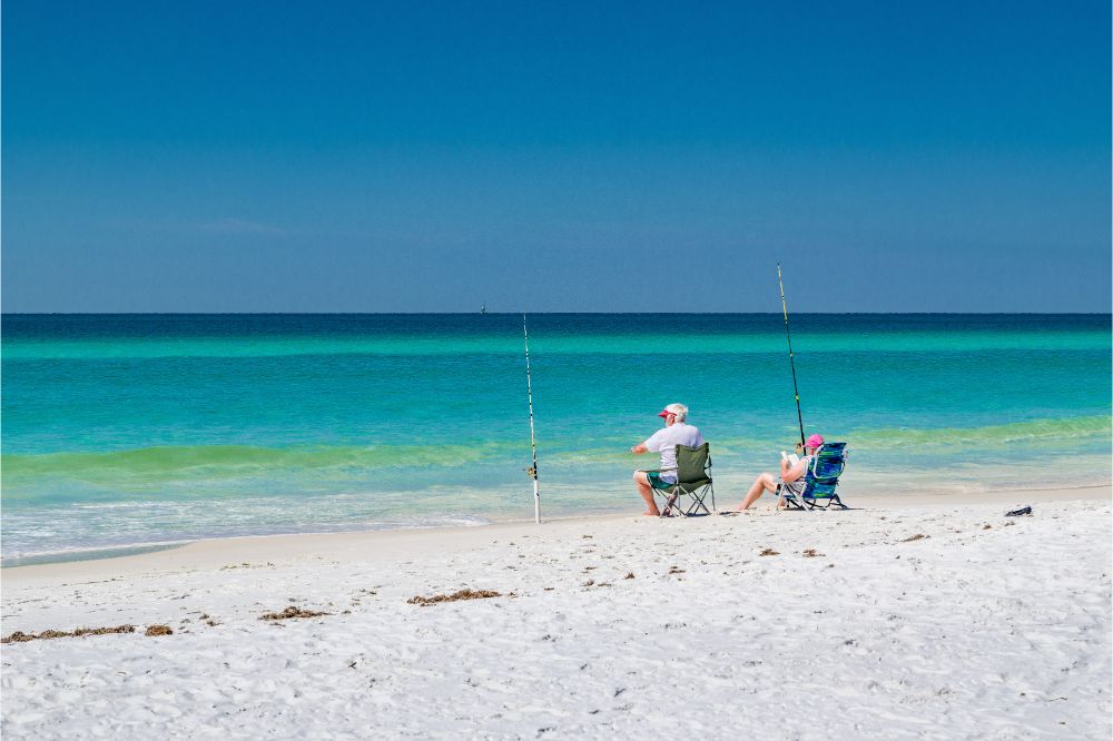 What Are the Best Seasons to Surf Fish in California 2 two fisherman fishing at shoreline sitting